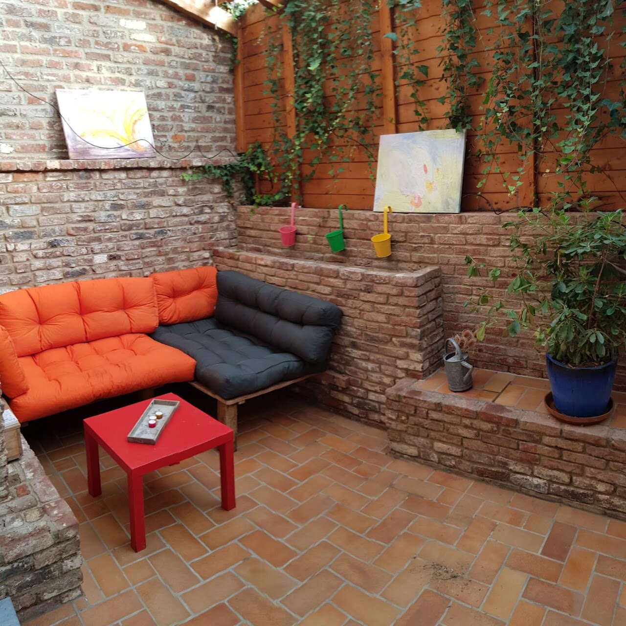 Living room with red sofa near the fireplace